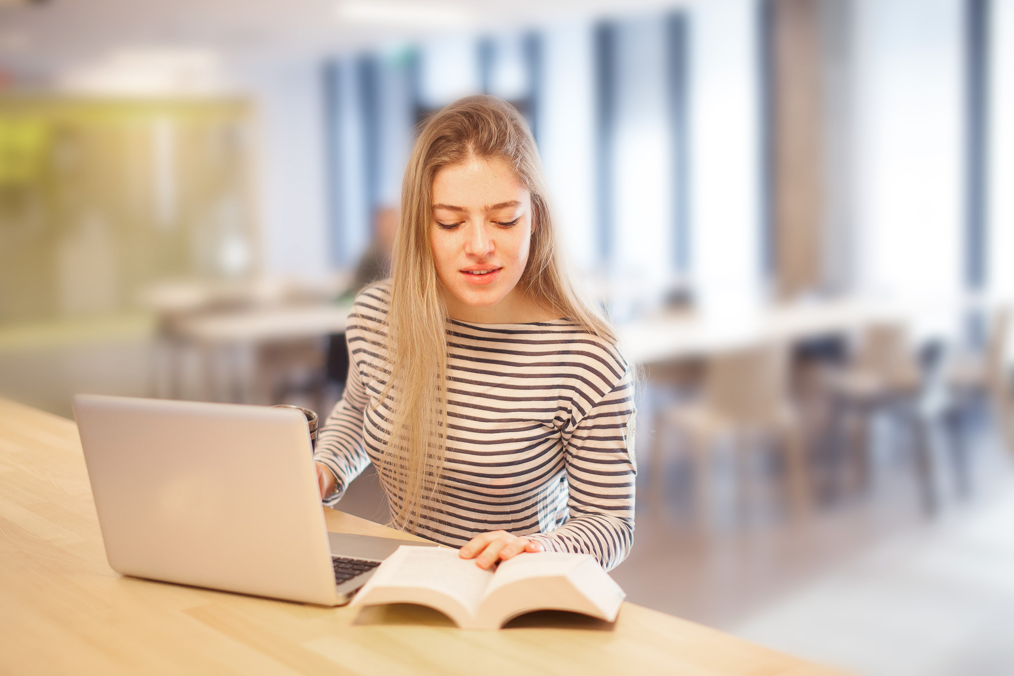 Female student using laptop
